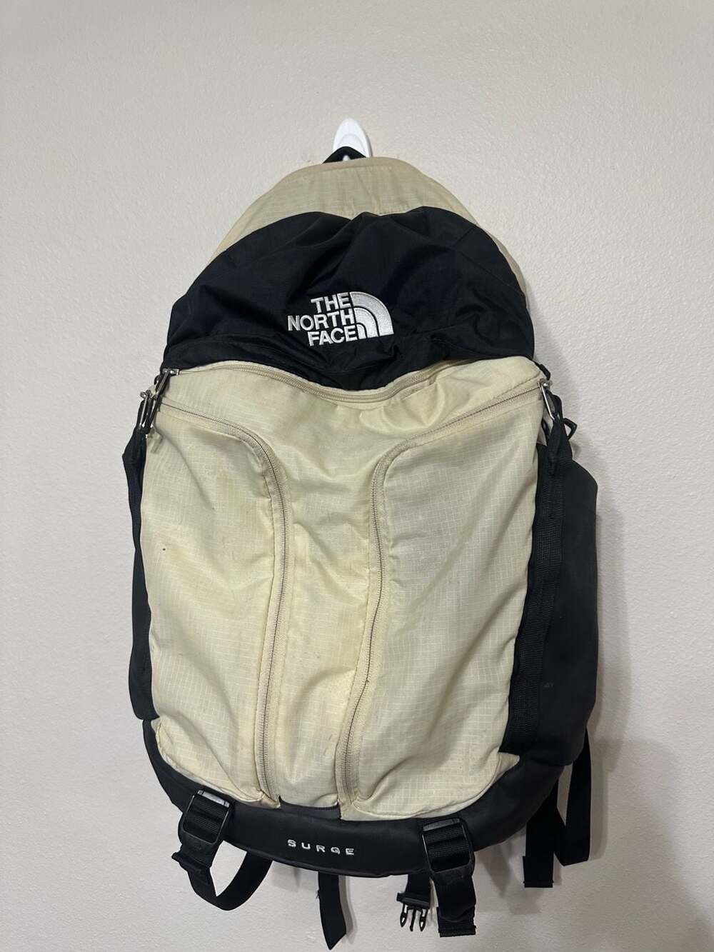 The North Face Surge Backpack in Beige and Black